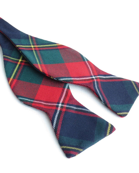 Plaid freestyle bow tie with red, blue, and green colors untied on a white background