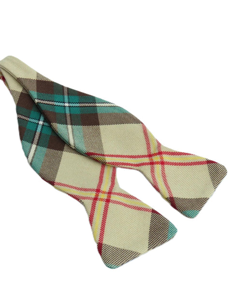 Yellow, green, brown and white plaid self tie bow tie on white background